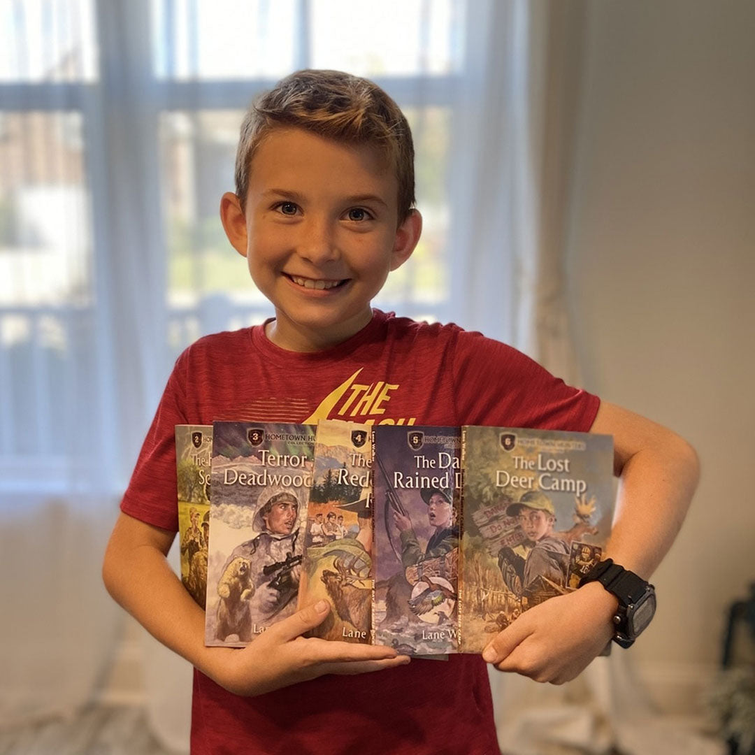 Kid 11-years-old holding books